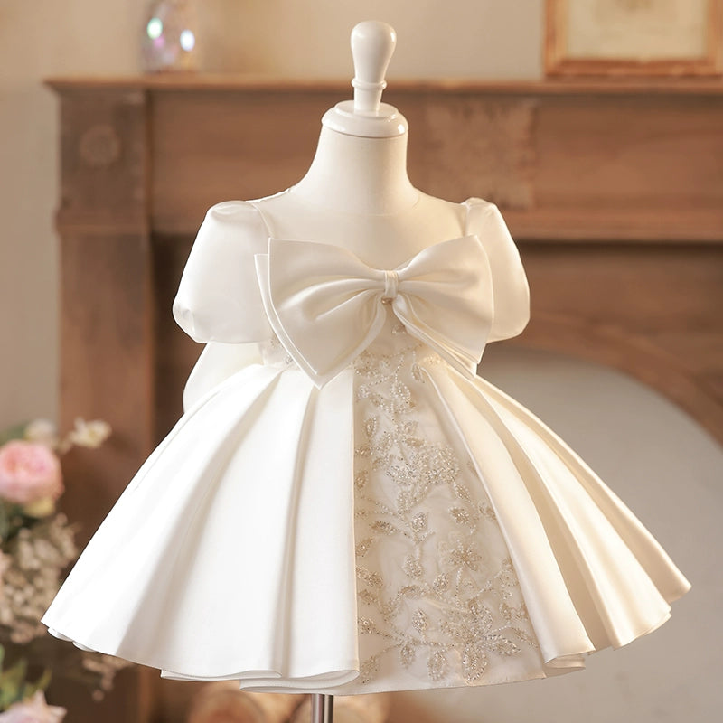 Cute Puffy White Satin Flower Girl Dress - Illusion Neckline, Sequins & Bow | Princess Tea Length Kids Gown