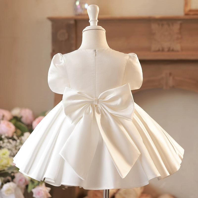 Cute Puffy White Satin Flower Girl Dress - Illusion Neckline, Sequins & Bow | Princess Tea Length Kids Gown